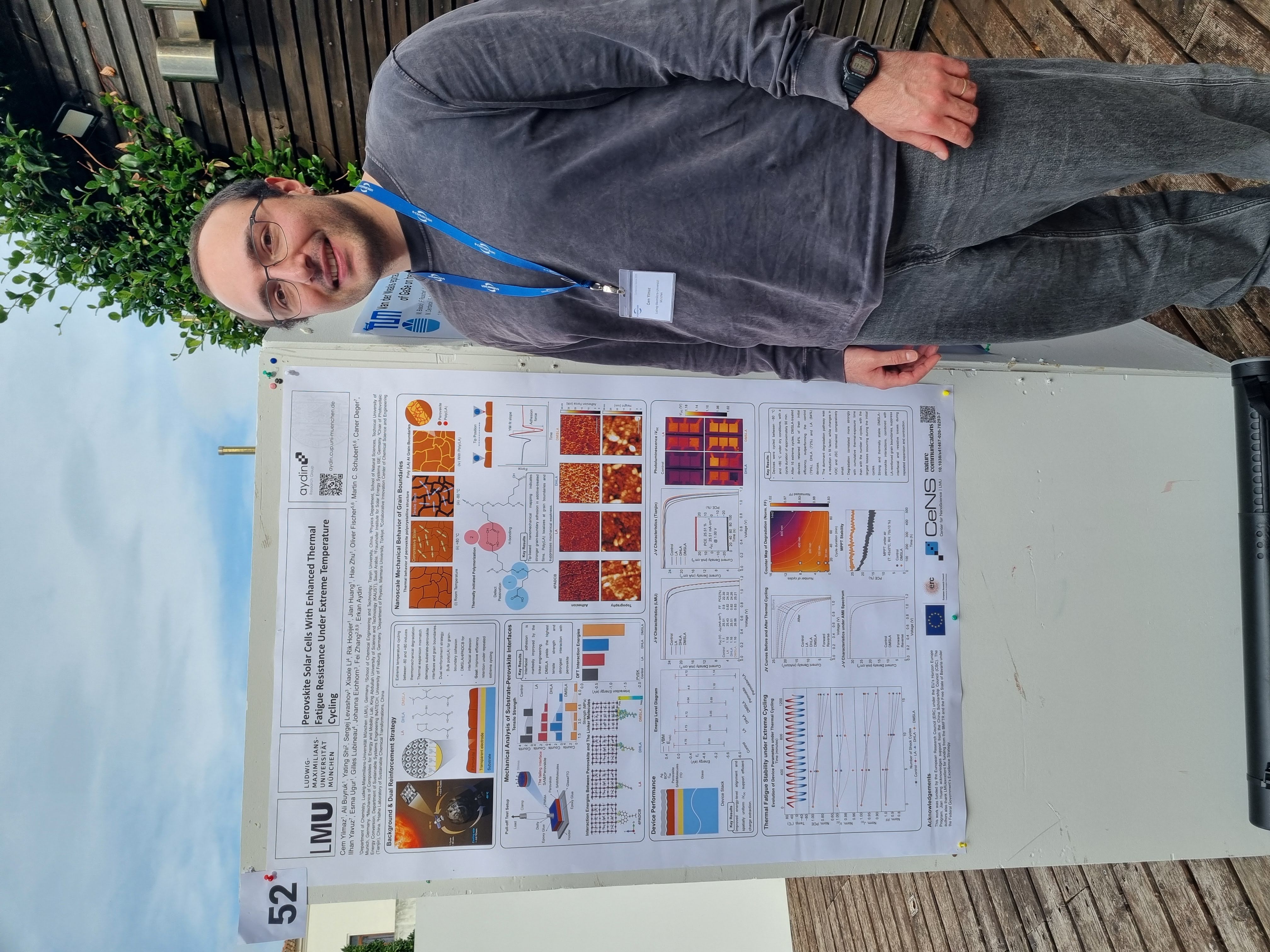 Cem Yilmaz standing in front of his research poster